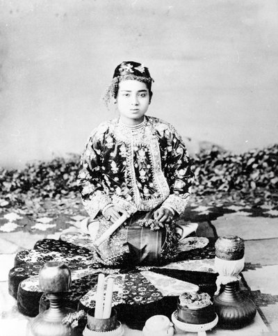 Young Burmese Woman with a Cigar, Mandalay by Felice Beato